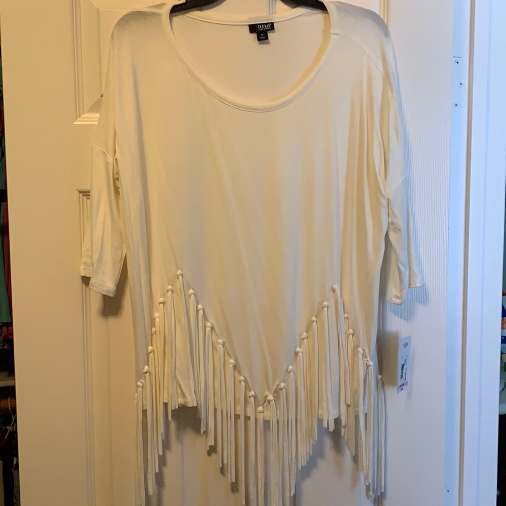 Adorable silky soft top w fringes on front. Round neck medium length sleeves.